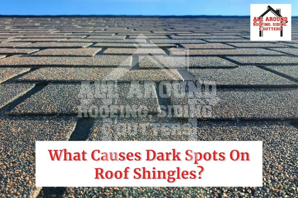 What causes dark spots on roof shingles