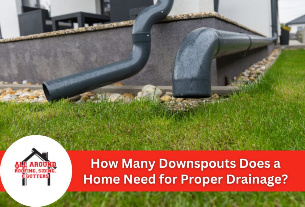 Close-up of home gutter drainage system with downspouts in a garden setting.